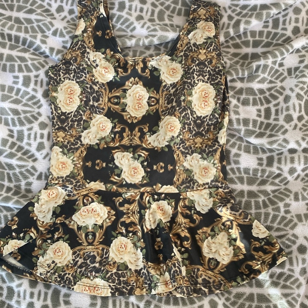 Black floral top with open back and bow